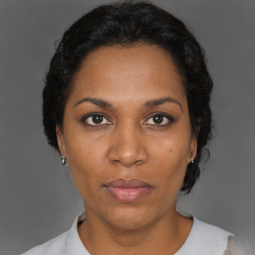 Neutral black adult female with short  brown hair and brown eyes