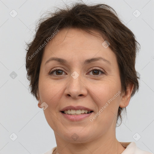 Joyful white adult female with short  brown hair and brown eyes