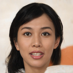 Joyful asian young-adult female with medium  black hair and brown eyes