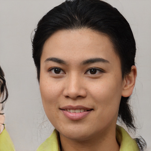 Joyful white young-adult female with medium  brown hair and brown eyes