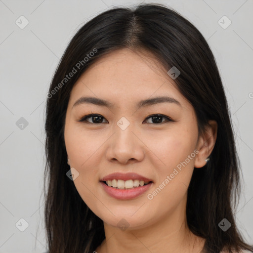 Joyful asian young-adult female with long  brown hair and brown eyes