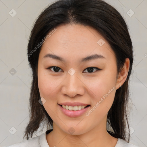 Joyful latino young-adult female with medium  brown hair and brown eyes