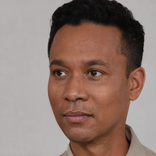 Neutral black young-adult male with short  black hair and brown eyes