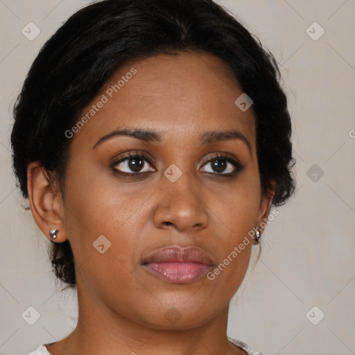 Joyful black young-adult female with medium  brown hair and brown eyes