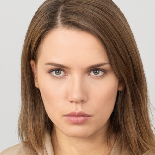 Neutral white young-adult female with long  brown hair and brown eyes