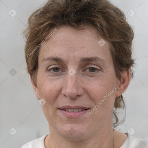 Joyful white adult female with short  brown hair and brown eyes