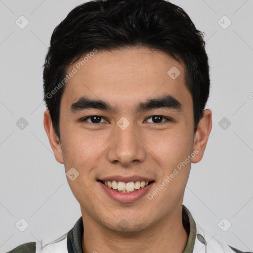 Joyful latino young-adult male with short  black hair and brown eyes