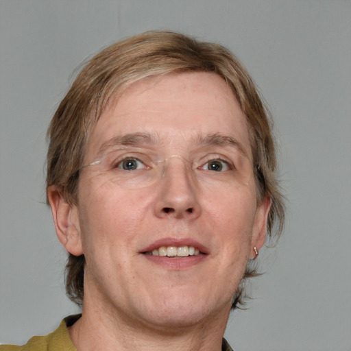 Joyful white adult male with medium  brown hair and grey eyes