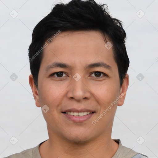 Joyful asian young-adult male with short  black hair and brown eyes