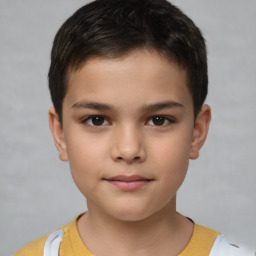 Joyful white child male with short  brown hair and brown eyes