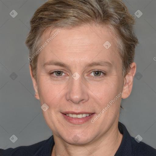 Joyful white adult female with short  brown hair and grey eyes