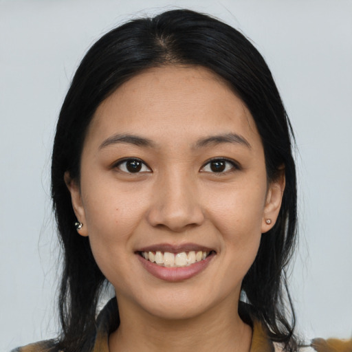 Joyful asian young-adult female with medium  black hair and brown eyes