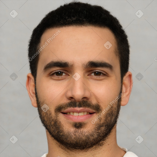 Joyful white young-adult male with short  black hair and brown eyes