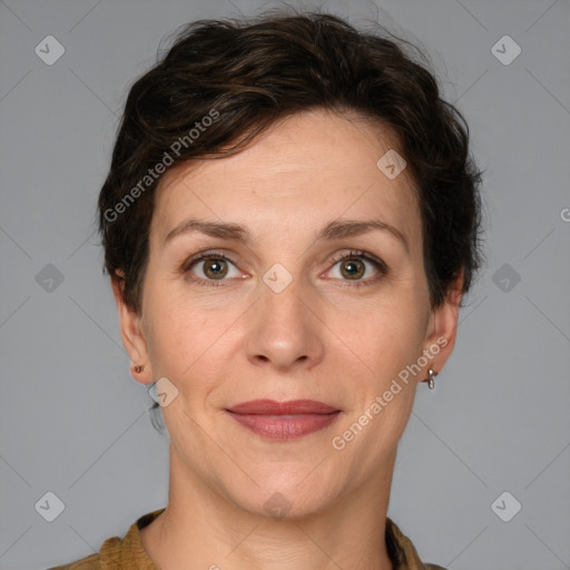 Joyful white adult female with short  brown hair and brown eyes