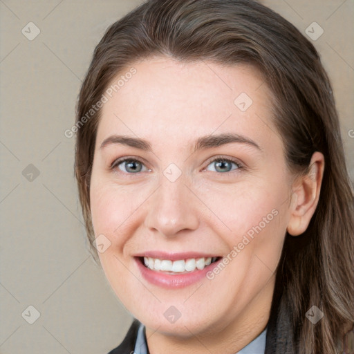 Joyful white young-adult female with long  brown hair and grey eyes