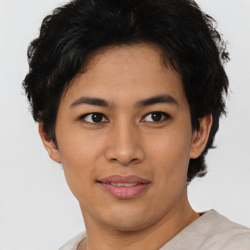 Joyful asian young-adult female with short  brown hair and brown eyes