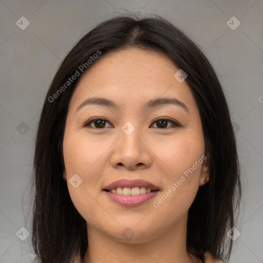 Joyful asian young-adult female with long  brown hair and brown eyes