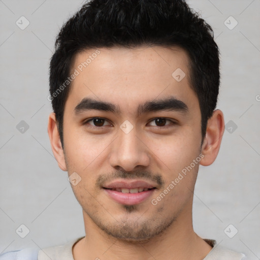 Joyful latino young-adult male with short  black hair and brown eyes