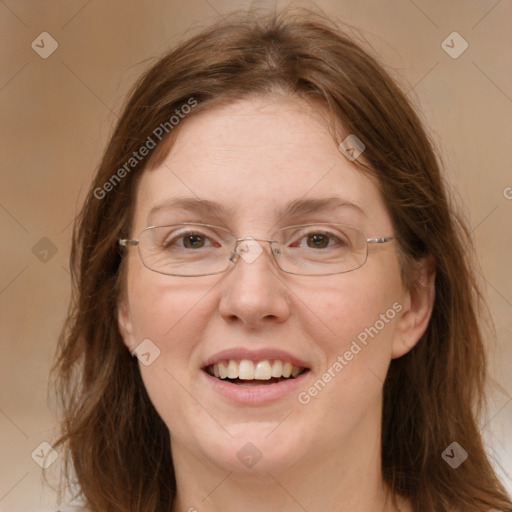 Joyful white adult female with medium  brown hair and blue eyes