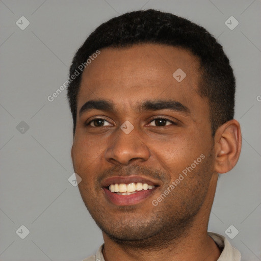 Joyful black young-adult male with short  black hair and brown eyes