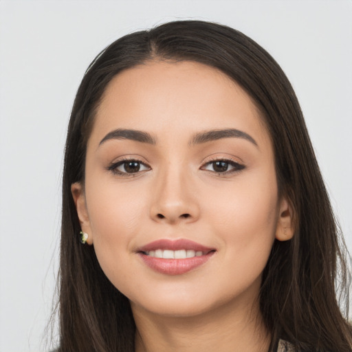 Joyful white young-adult female with long  black hair and brown eyes