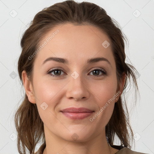 Joyful white young-adult female with medium  brown hair and grey eyes