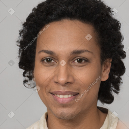 Joyful black adult female with short  brown hair and brown eyes