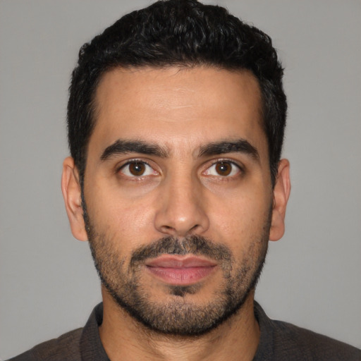 Neutral latino young-adult male with short  black hair and brown eyes