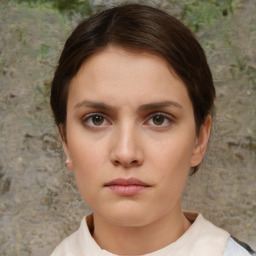 Neutral white young-adult female with short  brown hair and brown eyes