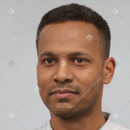 Neutral latino young-adult male with short  black hair and brown eyes