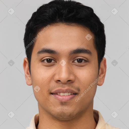 Joyful latino young-adult male with short  black hair and brown eyes