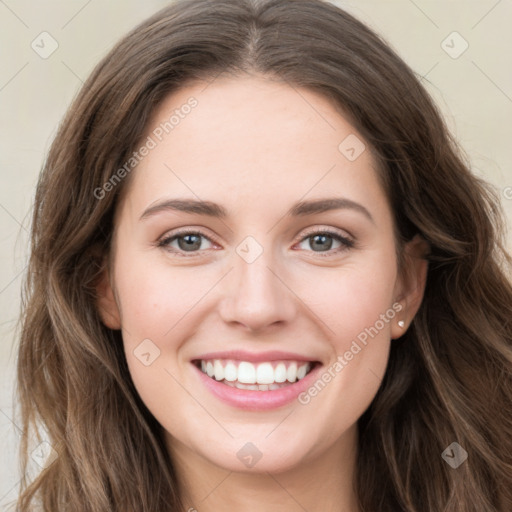 Joyful white young-adult female with long  brown hair and green eyes