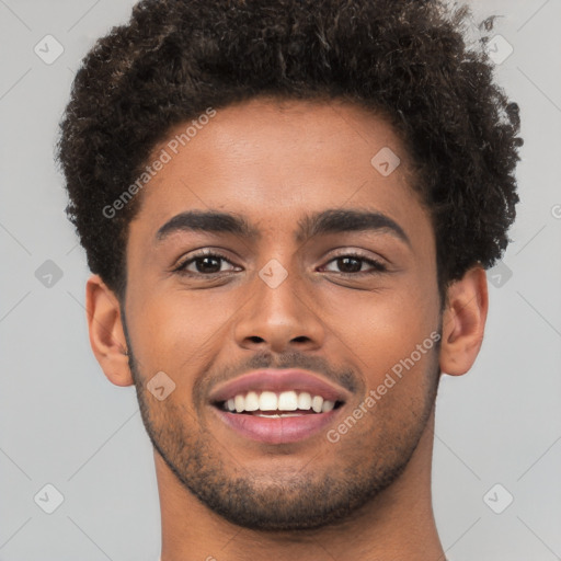 Joyful black young-adult male with short  brown hair and brown eyes