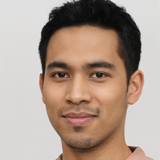 Joyful asian young-adult male with short  black hair and brown eyes