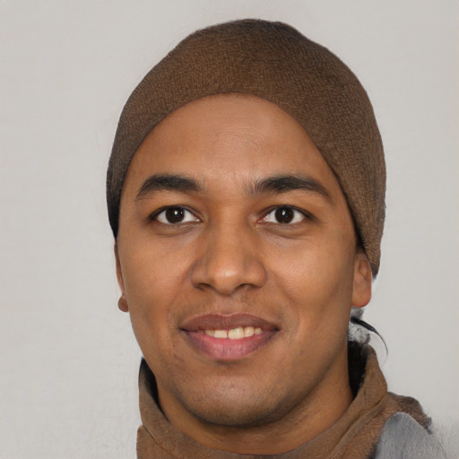 Joyful white young-adult male with short  black hair and brown eyes