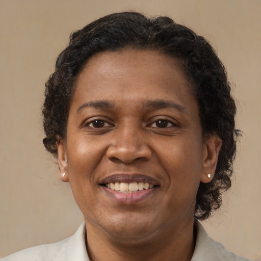 Joyful latino adult female with short  brown hair and brown eyes