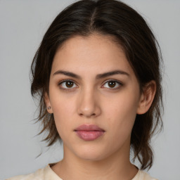 Neutral white young-adult female with medium  brown hair and brown eyes