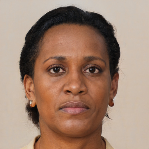 Neutral black adult female with medium  brown hair and brown eyes