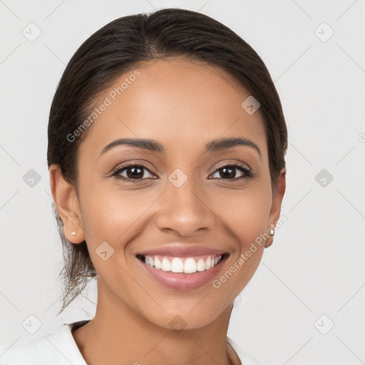 Joyful latino young-adult female with long  brown hair and brown eyes