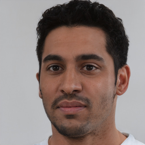 Neutral latino young-adult male with short  black hair and brown eyes