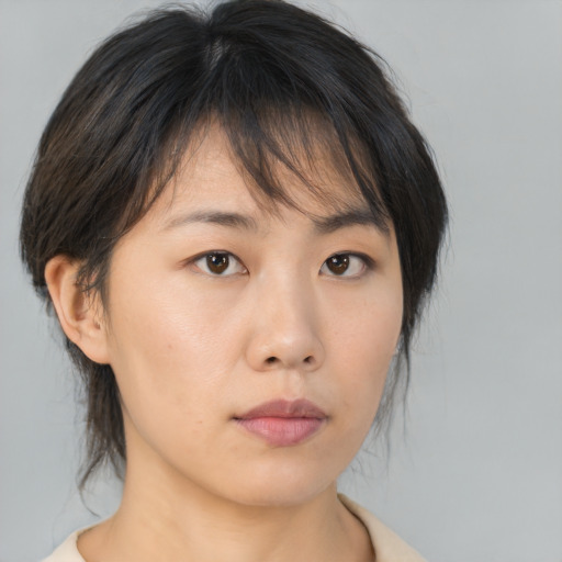Neutral asian young-adult female with medium  brown hair and brown eyes