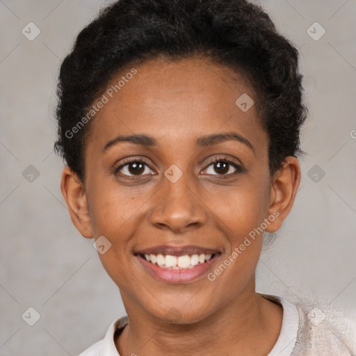 Joyful black young-adult female with short  brown hair and brown eyes