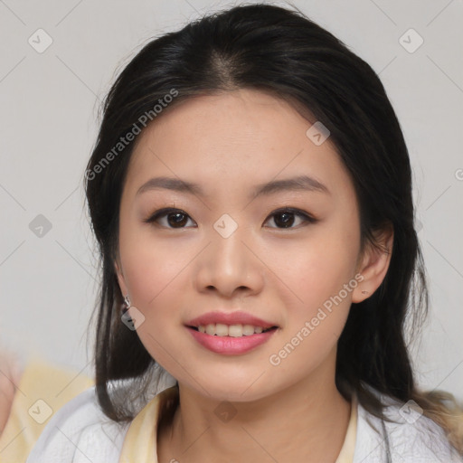 Joyful asian young-adult female with medium  black hair and brown eyes