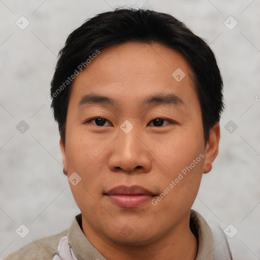 Joyful asian young-adult male with short  black hair and brown eyes