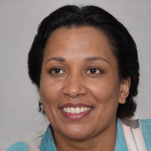 Joyful asian adult female with medium  black hair and brown eyes