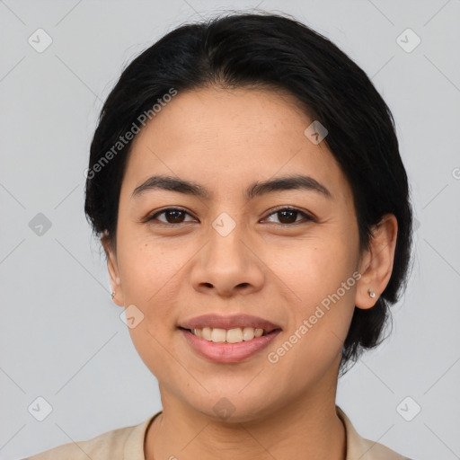 Joyful latino young-adult female with medium  black hair and brown eyes