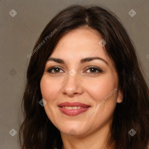 Joyful white adult female with long  brown hair and brown eyes