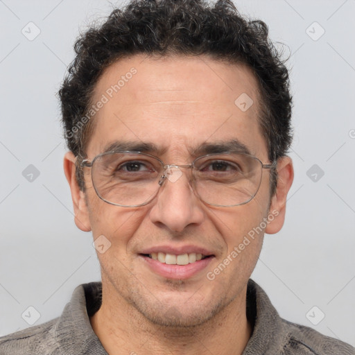 Joyful white middle-aged male with short  brown hair and brown eyes