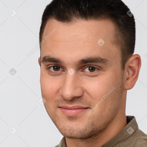 Joyful white young-adult male with short  brown hair and brown eyes