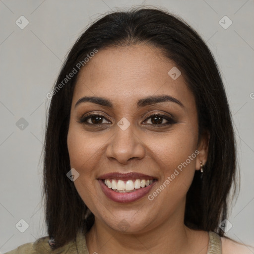 Joyful latino young-adult female with medium  brown hair and brown eyes